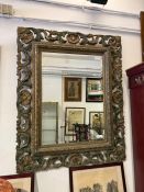 Grand miroir en bois sculpté